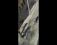 Woman blue coat walk street three cameramen