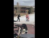 Two women in bikini with their ski equipment