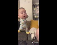 Big head baby dances yellow socks 