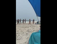 Bridesmaid with the bride take shots in front of the camera