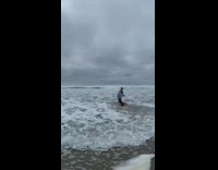Woman lay on beach drowned by waves