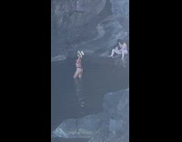 Woman black bikini beach hat beach cave