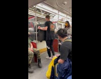 2 guys move couch off train 