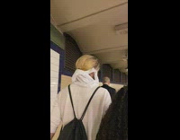 man with ponytail has white sheet on face