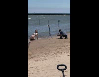 Woman bikini chain ornaments sit lean backwards beach