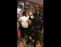 Girl Reaching for Pinata Candy Falls Over Girl at Party