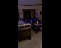 Old man sneaking tray across woman laying on couch