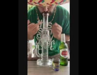 Green shirt guy sombrero hat beer shot 