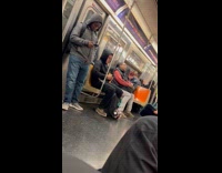 Old man holds stick circles inside train