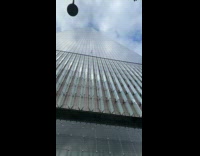 One World building airplane flyby on reflection