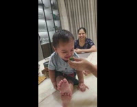 Woman try to give lime to baby
