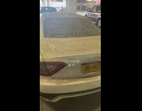 Dirty parked white car with boot