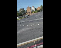 Guy rides wheelchair mobility scooter street road 