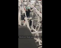Man does lat pulldown chest exercise funny at the gym