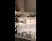 Snowplow plows over writing in snow valentines 