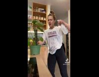 Girl waters plant instead of cheating 