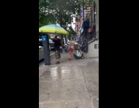 Man stands parking machine use umbrella tent