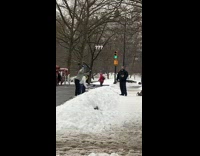 Three people exercise with blue steel mace 