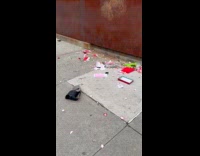 Ripped and shattered Valentine gift on sidewalk