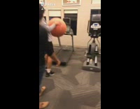 Guy pops yoga ball on treadmill