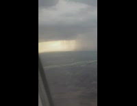 Plane view of rain clouds pouring down
