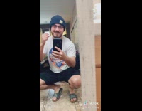 Guy changes outfits in mirror blue suit 