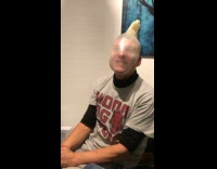 Man with rubber gloves on his head and its breaks