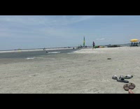 Man run toward ocean falls splash music