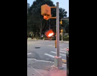 Pedestrian stoplight hang down from pole