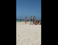 Old man photograph girl black bikini beach