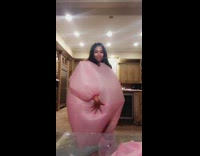 Girl in pink blow up costume dancing Too $hort Blow the Whistle