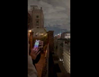 Woman controlling lights on world trade center 