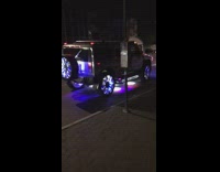 white hummer car with lots of lights around