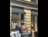 Guy plays air guitar on subway panel 