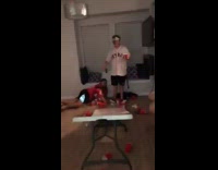 Guy in red 23 jersey  bodyslams beer pong table and breaks it