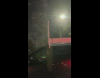 Car carry bed frame at the top of it along the highway