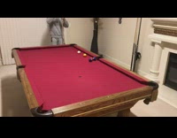 Grey sweater guy hits white ball billiards 