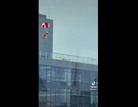 Woman tries to hang glide off NYC building 