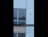 Guy sees santa in window reflection rooftop 