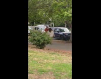 Girl sings for music video on sidewalk 