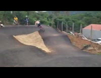 Guy rides bike outdoors helmet
