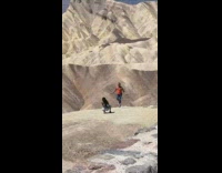 Red shirt guy jump ropes desert 