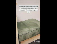 Green chair in dentist office with big butt imprint