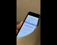 Person looking at sexually explicit thread on phone on train