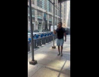 Man walk on street cat on shoulder