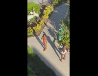 Woman orange bikini photo shoot walkway garden