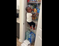 Boy caught sneaks getting snacks at pantry