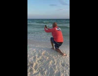Man shirtless mocks two women photoshoot at the beach