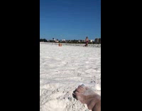 Girl bikini purple cloth stand near seagulls