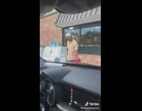 Dad and daughter wear matching hats after ice cream